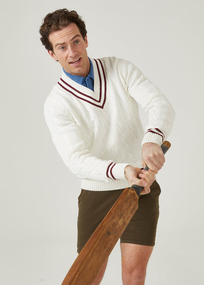 Ecru cricket jumper with a claret red trim and cable knit design.